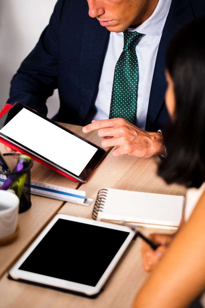 man-showing-his-report-to-her-colleague